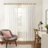curtain poles for living room curtain poles for living room - Stylish living room with flowing sheer curtains on a bronze colour curtain rod, paired with a single seater, and a table —creating a chic, inviting ambiance.