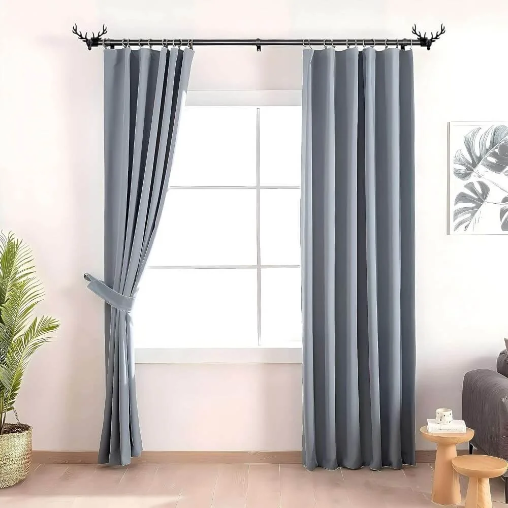 curtain rod and holders for living room curtain rod and holders for living room - Elegant sheer curtain gracefully hanging from a matte black curtain rod with deer finial installed on a living room window, creating an airy and sophisticated look