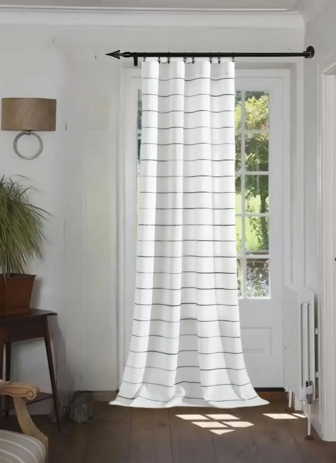 curtain pole for window against wall curtain pole for window against wall - Elegant floor-length curtains hanging on a matte black curtain rod mounted on a wall-adjacent door. Showcases space-saving design with sturdy brackets and seamless fabric drape