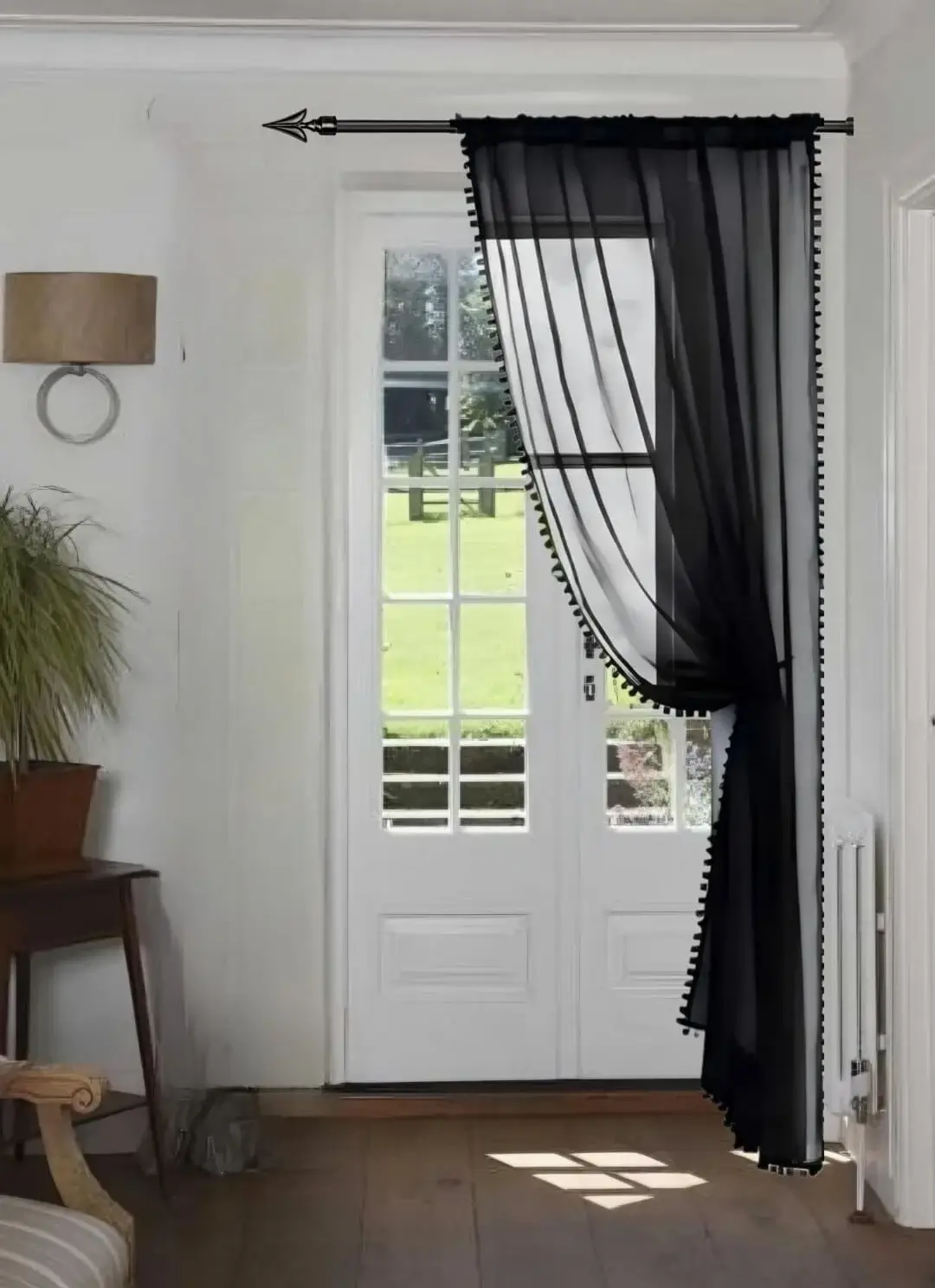 curtain pole next to wall curtain rod next to wall - Elegant floor-length curtains hanging on a matte black curtain rod mounted on a wall-adjacent door. Showcases space-saving design with sturdy brackets and seamless fabric drape