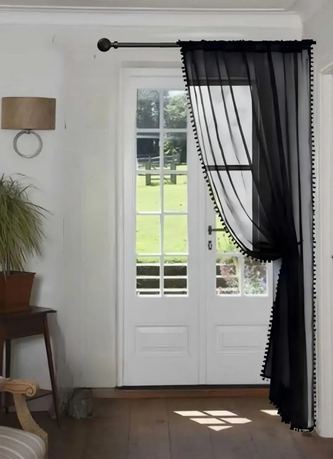 curtain rod against wall curtain rod against wall - Elegant floor-length curtains hanging on a matte black curtain rod mounted on a wall-adjacent door. Showcases space-saving design with sturdy brackets and seamless fabric drape