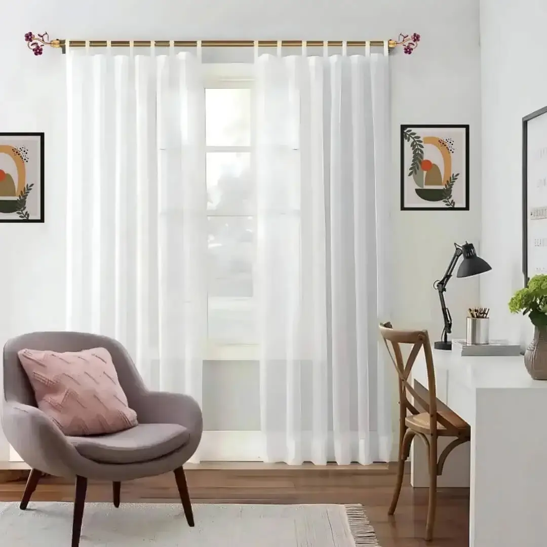 adjustable curtain rod set for a room adjustable curtain rod set for a room - Stylish living room with flowing curtains on a gold curtain rod, paired with a single seater, and a table —creating a chic, inviting ambiance.