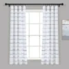 curtain rods for windows curtain rods for rooms - Elegant checks curtain gracefully hanging from a sleek black curtain rod installed on a bedroom window, creating an airy and sophisticated look