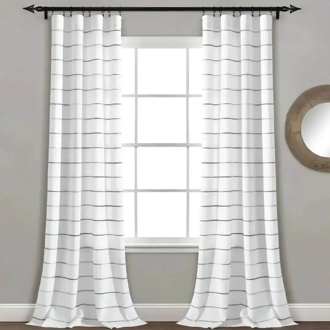 black curtain rod set for living room black curtain rod set for living room - Stylish living room with flowing curtains on a black curtain rod, paired with a wall art —creating a chic, inviting ambiance.