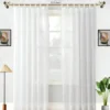 curtain pole for living room curtain pole for living room - Elegant transparent floor-length white sheer curtains hanging from a sleek antique finish curtain rod installed on a small window of a living room—creating a modern, flowing look while maintaining privacy and natural light.