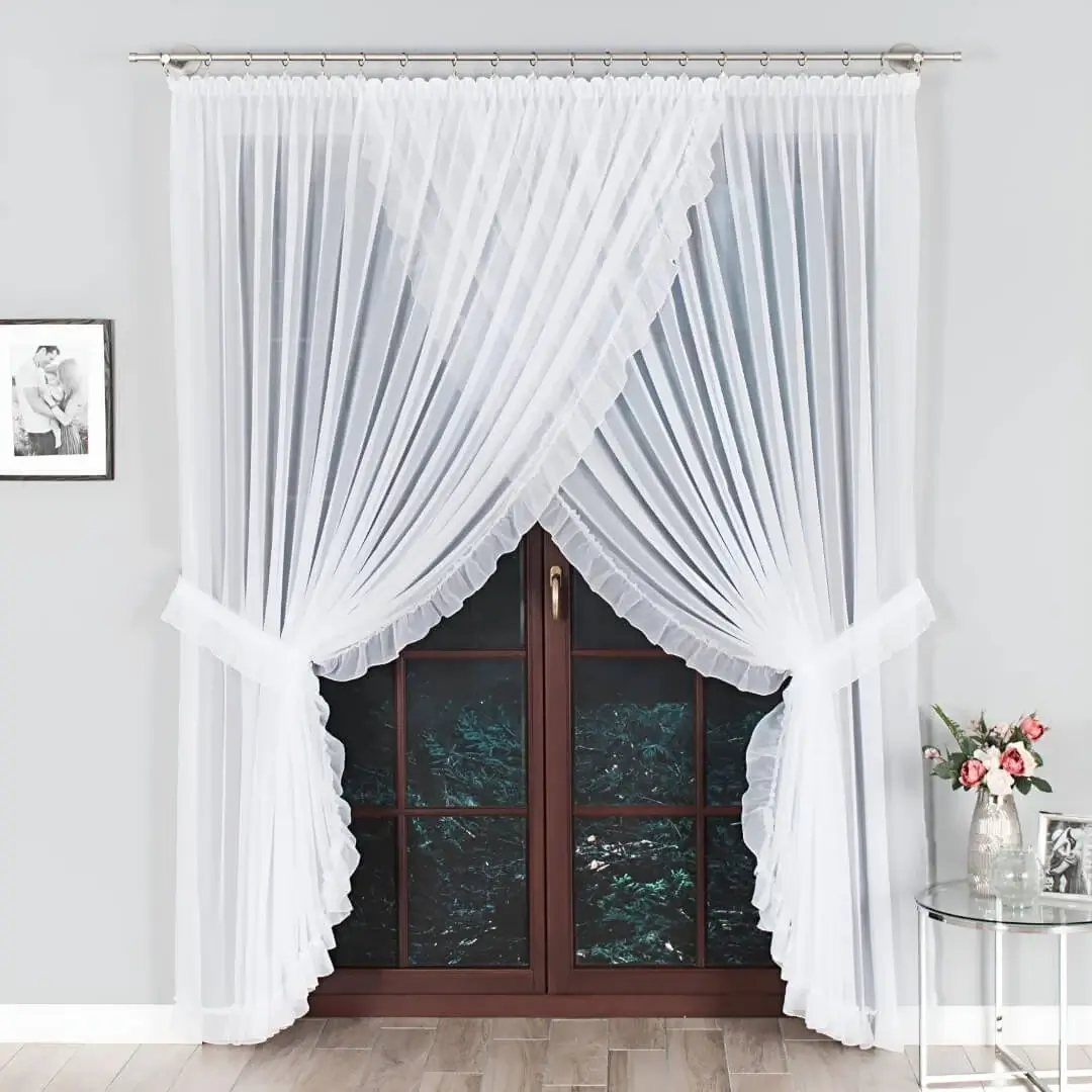 curtain rod for home curtain rod for home - A stylish living room in a modern home with floor-length white pinch-pleat drapes hung on sleek chrome-finish curtain rods, framing a long door. Paired with a complementary wall painting, the space exudes a chic and inviting ambiance