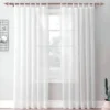 pink gold curtain rod for living room pink gold curtain rod for living room - Elegant white floor-length sheer curtains hanging from a sleek rose curtain rod installed on a window—creating a modern, flowing look while maintaining privacy and natural light