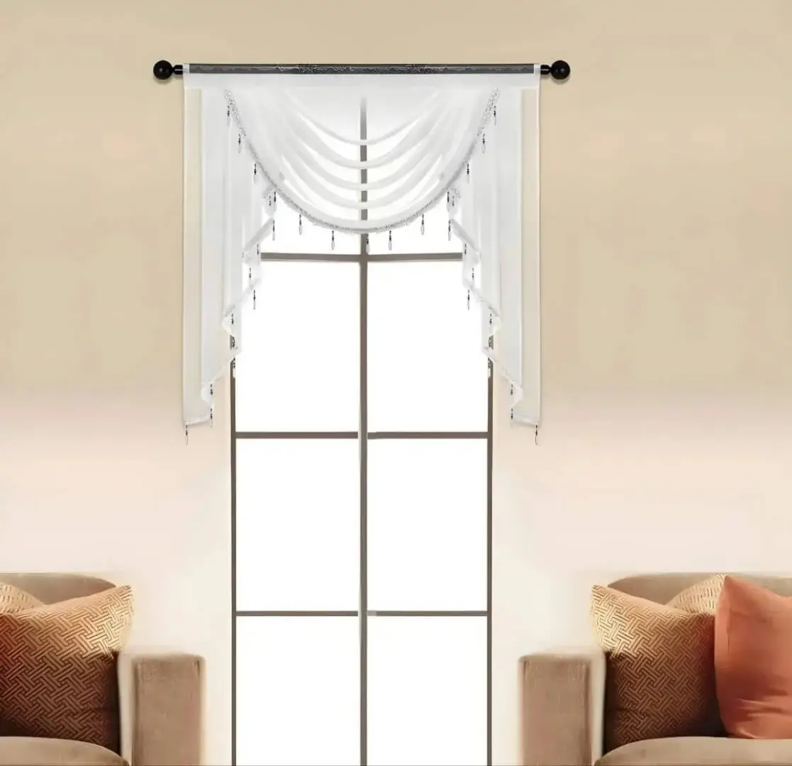 black curtain rods for living room black curtain rods for living room - Elegant sheer valance curtains hanging from a black curtain rod, perfectly fitted on a living room window. Ideal for modern spaces and cozy interiors