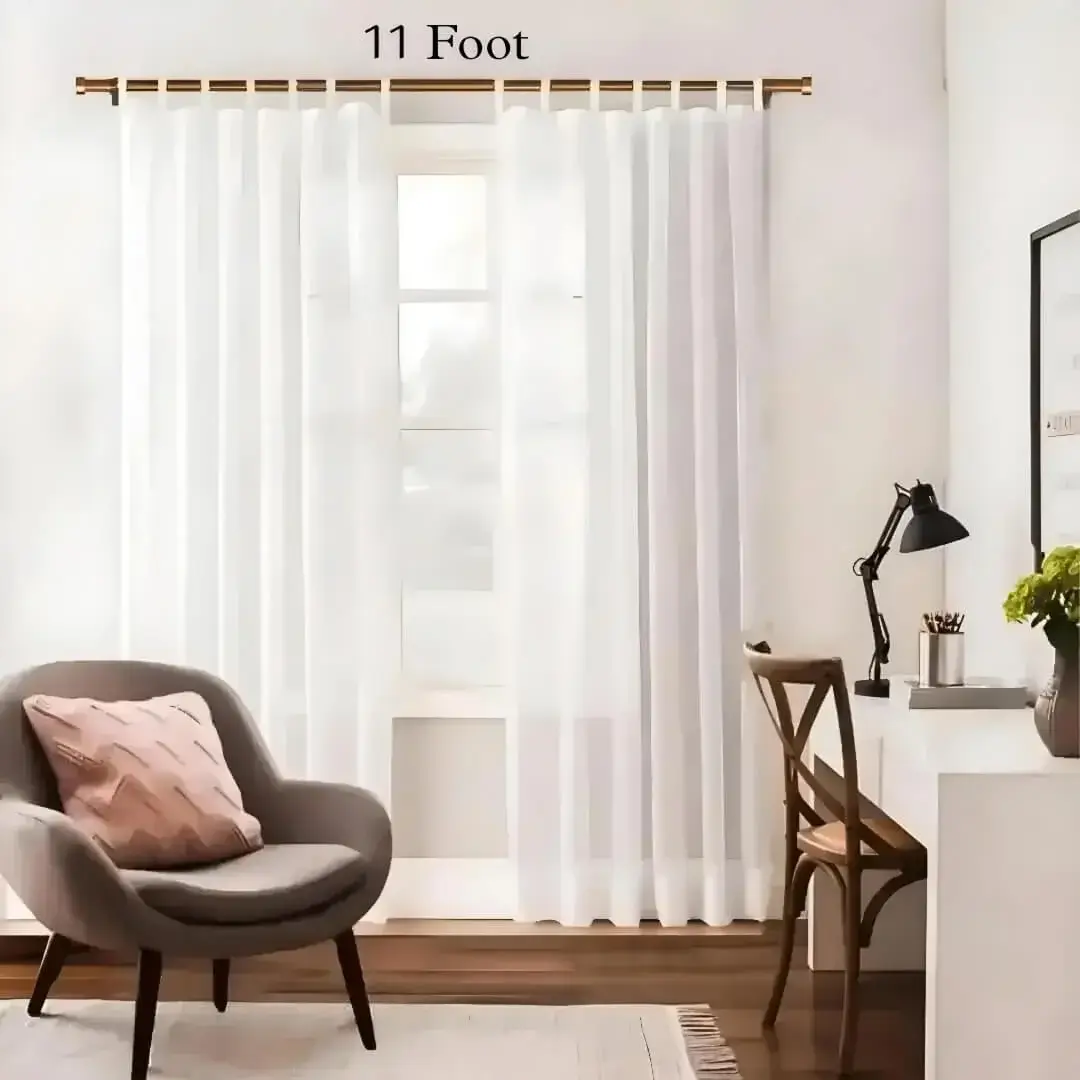11 foot adjustable curtain pole 11 foot adjustable curtain pole - Stylish living room with flowing curtains on a 11 foot adjustable curtain pole, paired with a study table, and single seater sofa set—creating a chic, inviting ambiance.
