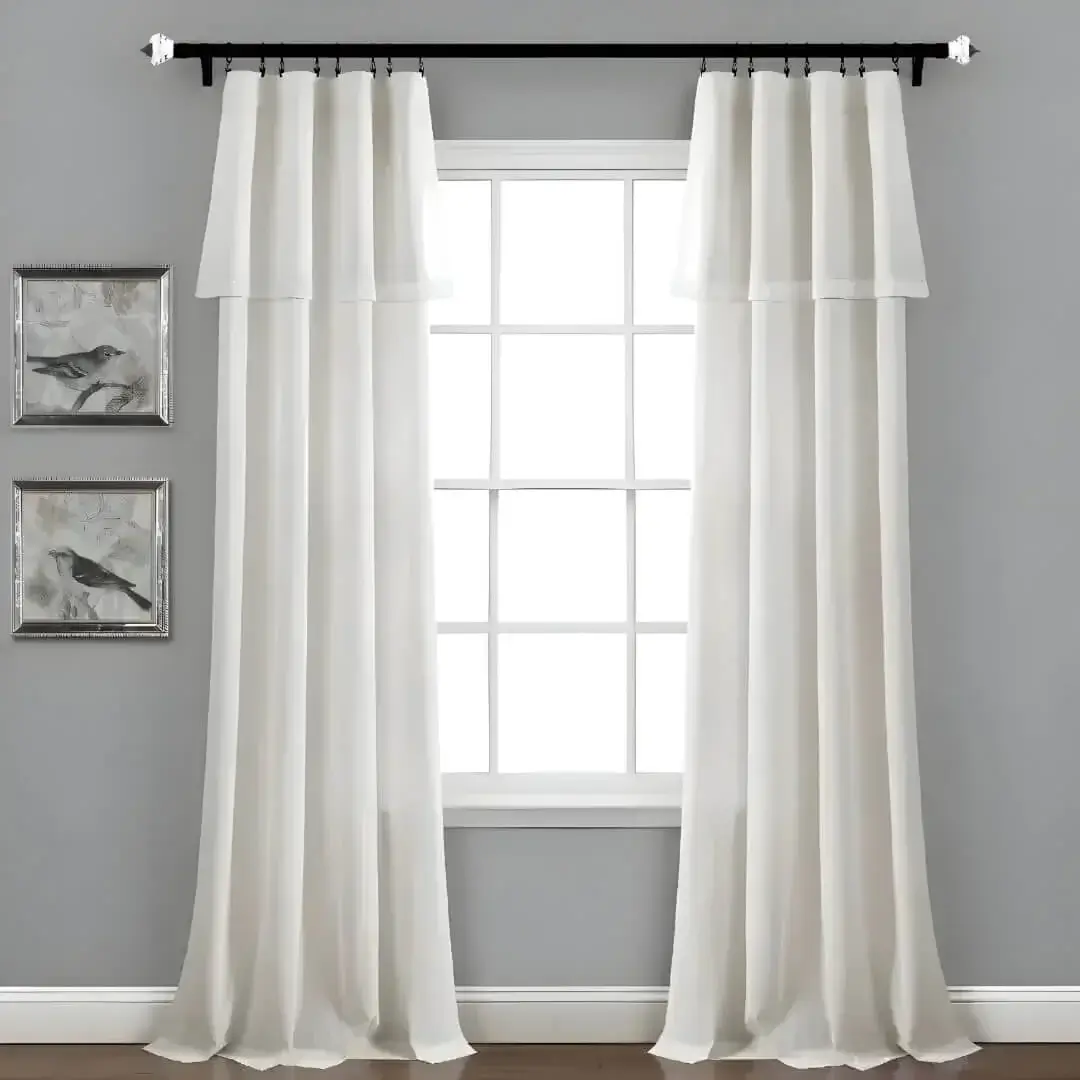 extra long extendable curtain rods - Creating a luxury and inviting ambiance with an adjustable black curtain rod featuring a crystal finial, shown holding elegant white curtains in a living room.