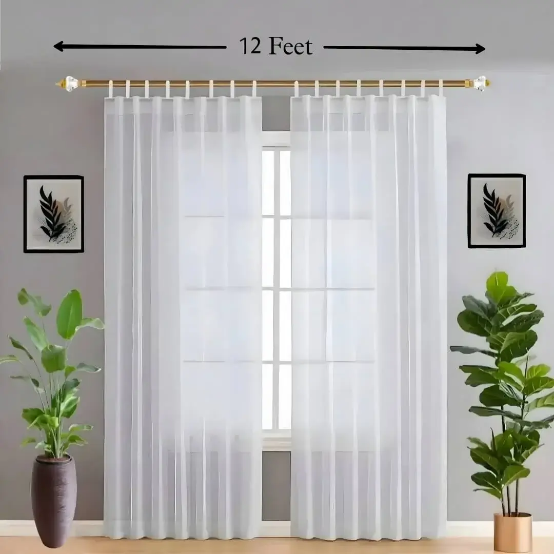 12 feet adjustable curtain rods 12 feet adjustable curtain rod - A stylish living room featuring flowing sheer curtains on an adjustable 12-foot (144-inch) gold curtain rod. The setup is complemented by wall art and decorative potted plants, creating a chic and inviting ambiance. Text highlight: '12-foot'.